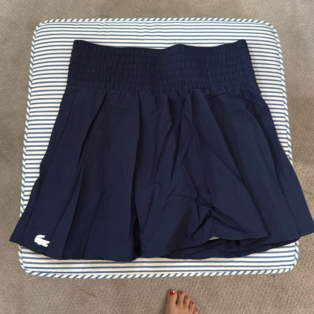 Lacoste women’s navy tennis skirt with green undershorts